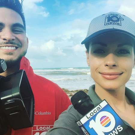 Sanela with her cameraman while covering up news of hurricane.